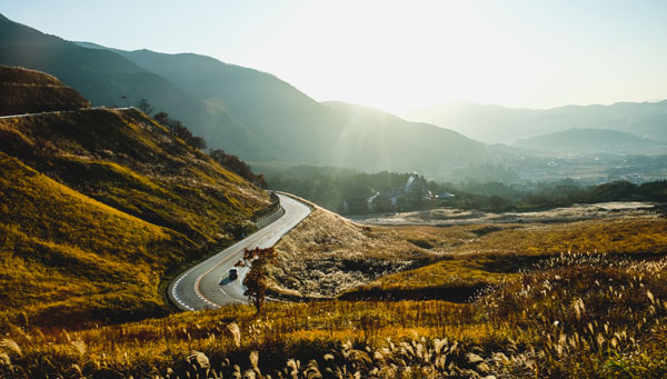 Photo of a winding road over hills